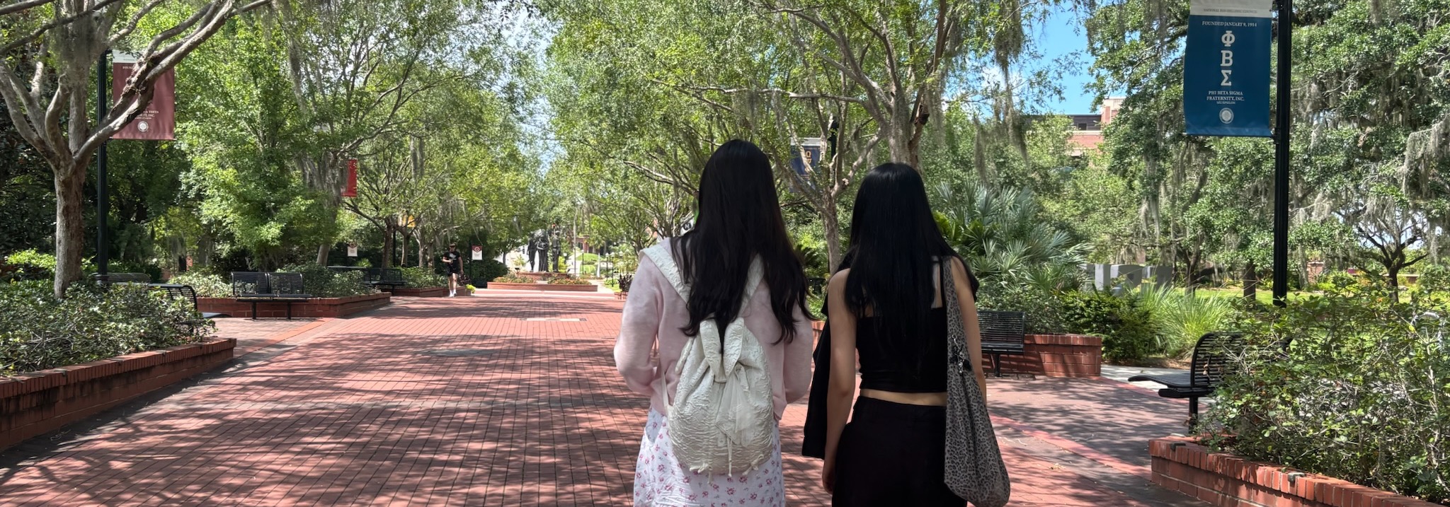 Two students walking on campus