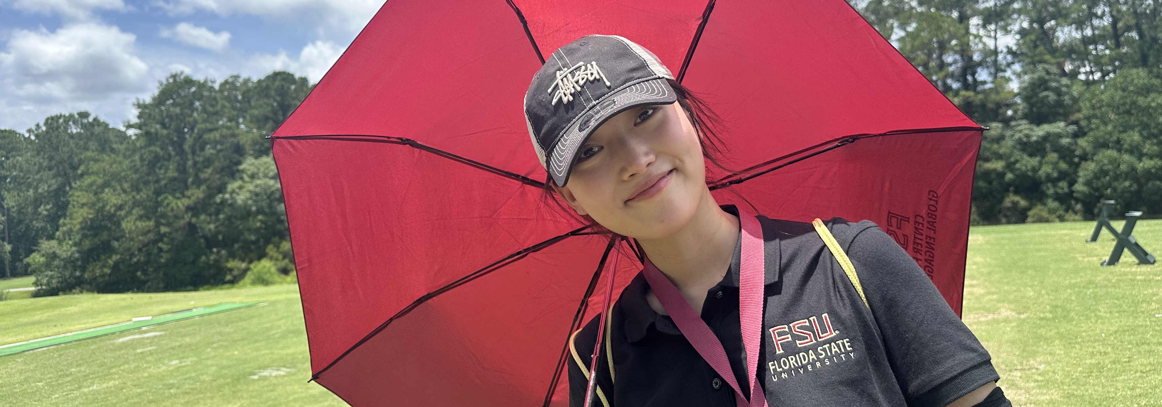 Student holding umbrella
