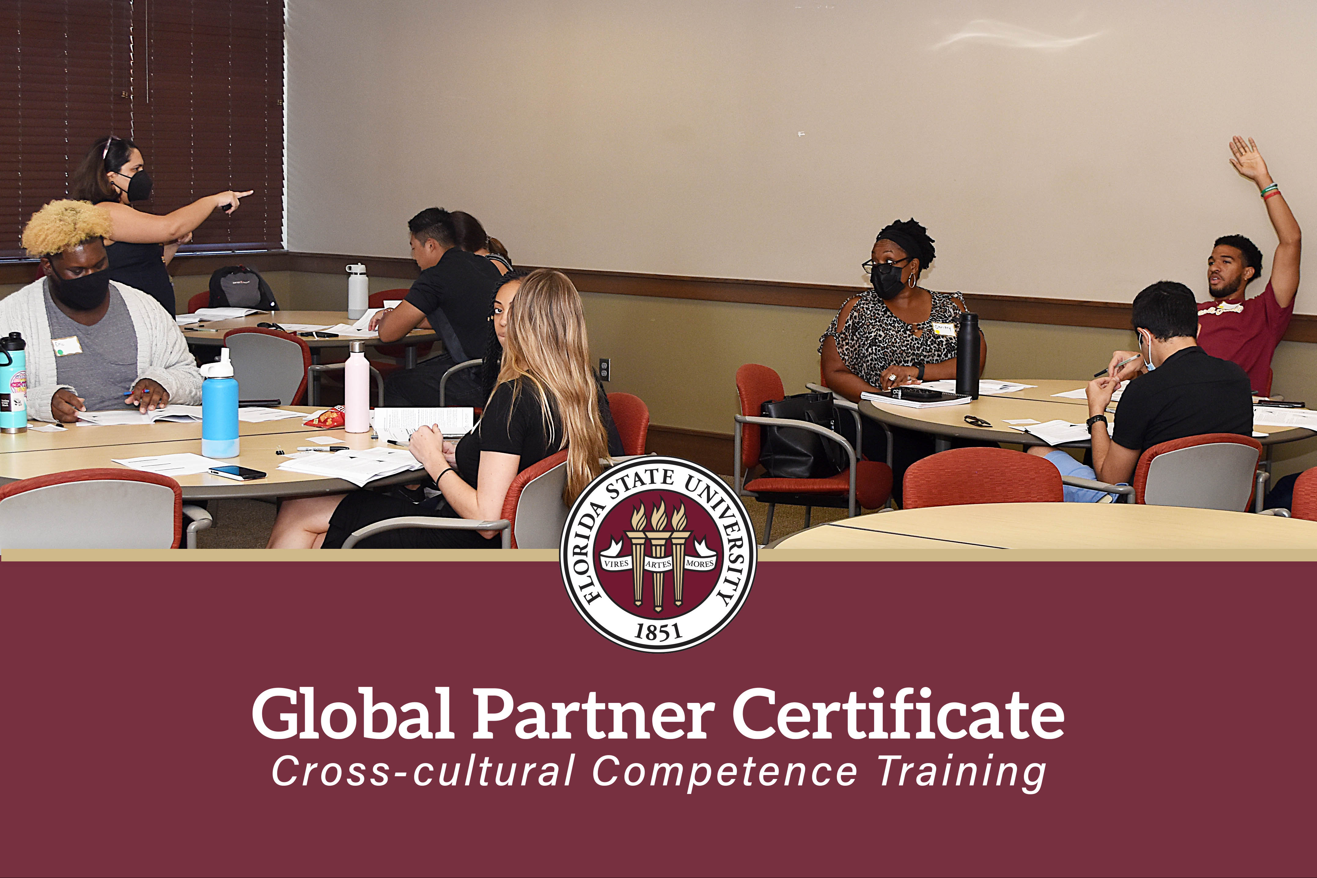 Florida State University's Global Partner Certificate: Cross-cultural Competence Training. Dr. Tanu Kohli Bagwe calls on a participant with their hand raised in class.