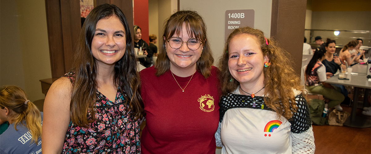 Global Noles: A Global Nole and two international students at International Coffee Hour