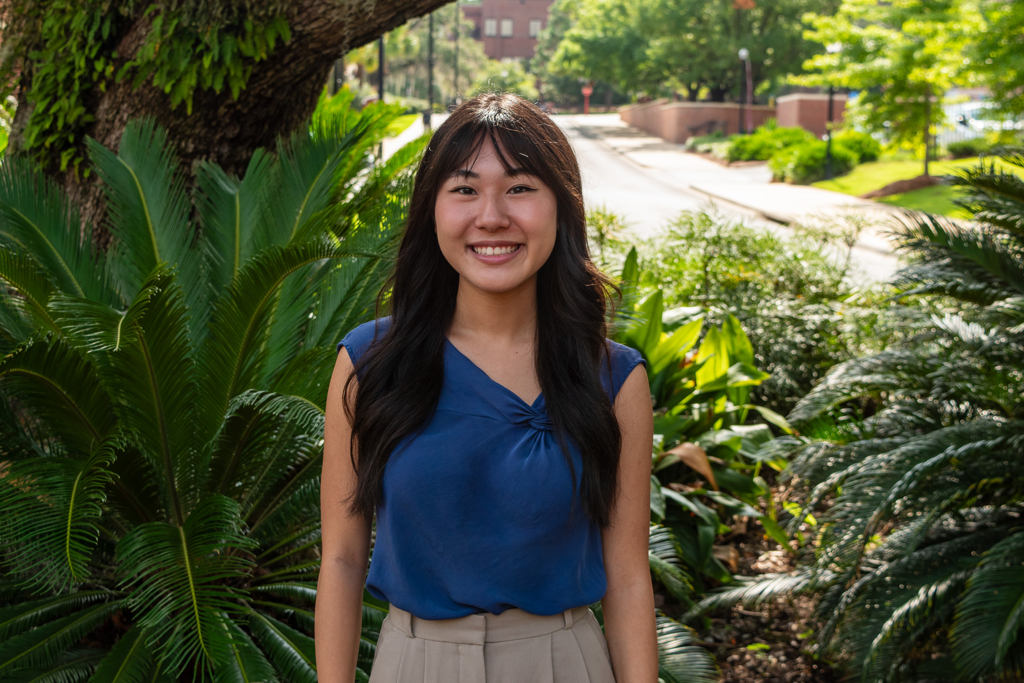 Staff Spotlight: Mia Kawamitsu, posing for a photo on the FSU campus.